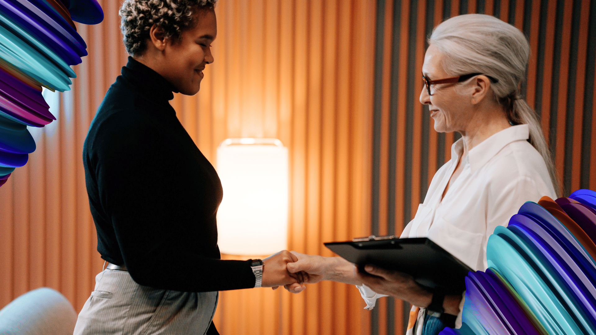 Skills-based hiring in action: A handshake between two women, highlighting the importance of hiring for skills and potential.