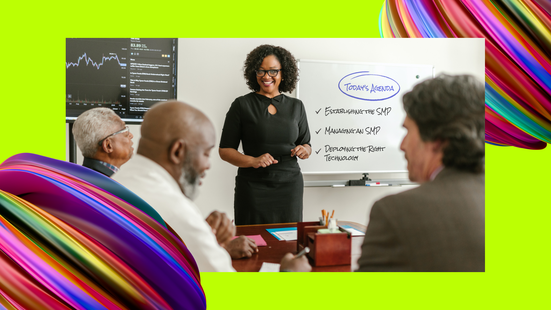 A woman is teaching a class in front of a whiteboard that has points on establishing and managing a supplier management program.