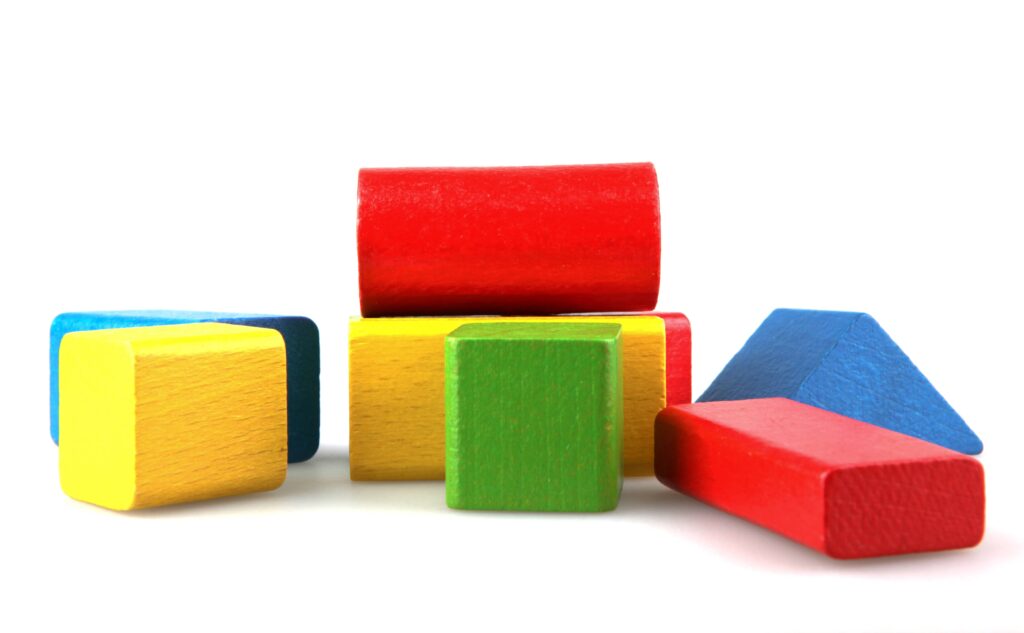 An illustration of a pile of unorganized blocks symbolizing the struggles that customizing options can cause to an extended workforce strategy.