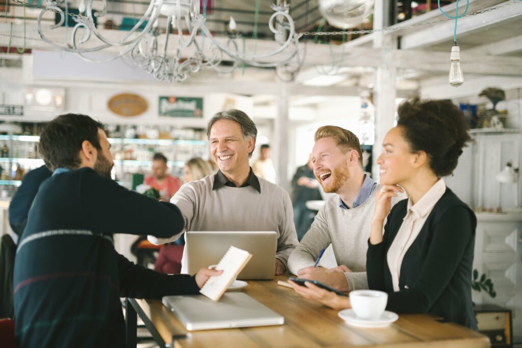 A group of smiling people depicts the different personalities, skills and talents that make up the extended workforce of today.