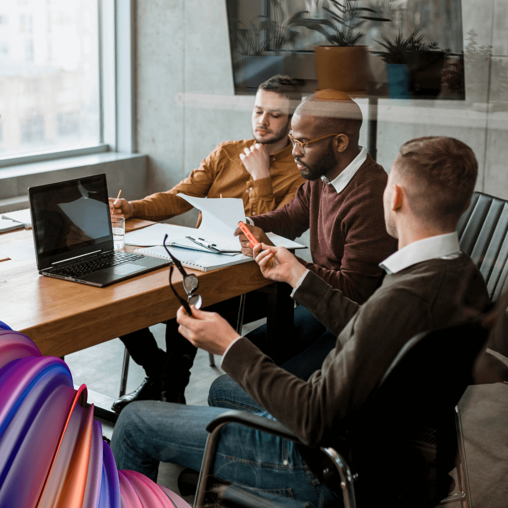 A group of temporary workers sourced by agencies is collaborating on the extended workforce around a table.