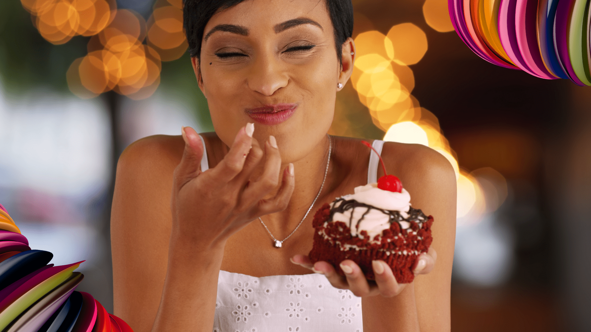 A woman enjoying a cupcake, representing how granular data impacts people analytics through optimizing human potential to delight with experiences.