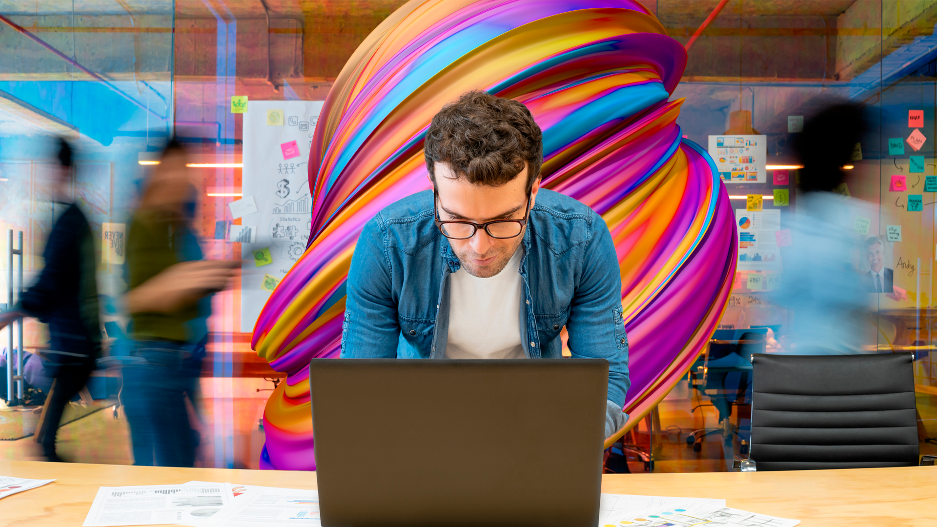 Young man using his laptop to measure KPIs through his VMS.