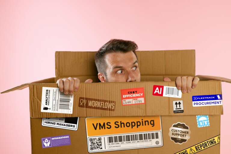 VMS buyer peeking out of a box